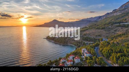 Stanici village with main beach against sunset over the sea near the Omis in Croatia Stock Photo