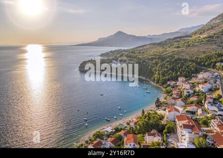 Stanici village with main beach and boats on sea near the Omis in Croatia Stock Photo