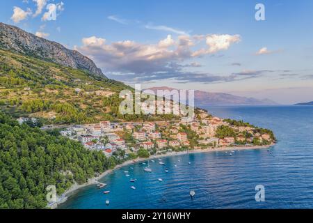 Stanici village with main beach and boats on sea near the Omis in Croatia Stock Photo