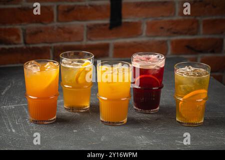 Glasses of assorted fruit lemonade beverages Stock Photo