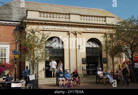 Sidmouth Indoor Market With Tourists, Public Sitting Outside In The Market Square, Sidmouth,Devon, UK Stock Photo