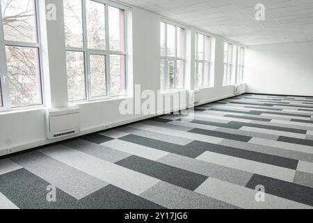 Empty office space With Checkered Floor and Windows Stock Photo