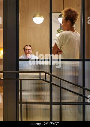 View through to meeting space. Woolyard, London, United Kingdom. Architect: Conran & Partners, 2022. Stock Photo