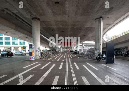 03-09-2024 Zurich, Switzerland. Wide empty road under Hardbrücke or Hardbrucke bridge near the train station entrance, no people Stock Photo