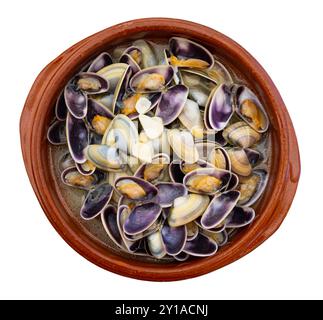 Steam cooked Mediterranean clams served in clay bowl Stock Photo