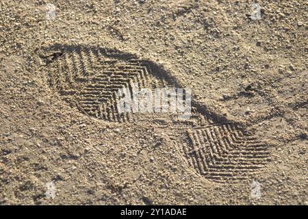 shoe prints in the sand Stock Photo