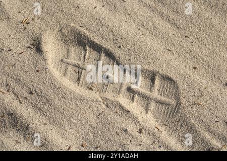 shoe prints in the sand Stock Photo