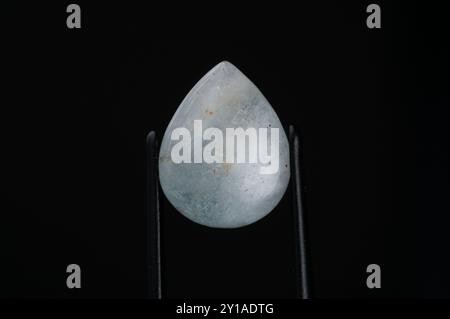 Exquisite Aquamarine Gemstone Elegantly Displayed Against a Dark Background. Stock Photo