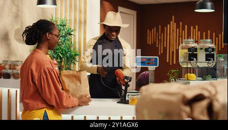 Photo inspiration: Fresh Look at Regular Customer Approaching Checkout With Organic Items Preparing To