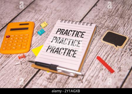 Concept of Practice, Practice, Practice write on sticky notes isolated on Wooden Table. Stock Photo