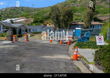 Road works digging construction in residential streets California. Stock Photo