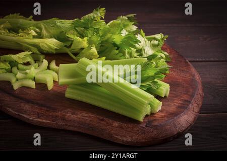 Fresh bunch of celery, top view, no people, on a dark background Stock Photo