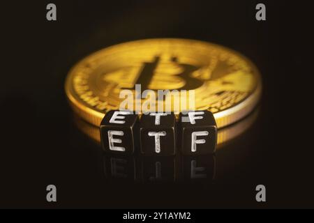 Bitcoin Exchange-traded fund ETF launch concept with coins and letters Stock Photo