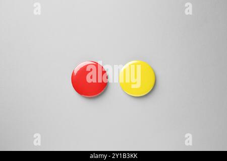 Blank colorful button badges on grey background, top view. Mockup for design Stock Photo