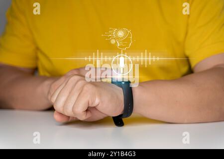 Person use smartwatch with voice recording or speech recognition technology, Personal assistant app to give command or send message using AI artificia Stock Photo