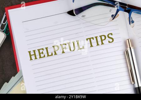 Helpful Tips words there is a memo for analysis in the business notebook Stock Photo
