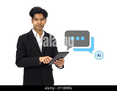Young asian businessman in white shirt and black suit typing on tablet computer, live chat chatting with AI. Social network concepts, chatting convers Stock Photo
