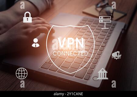 Woman hand using laptop with vpn icon on VR screen. VPN Virtual Private network protocol concept. VPN concept. Stock Photo
