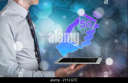 5g concept above a tablet held by a man Stock Photo