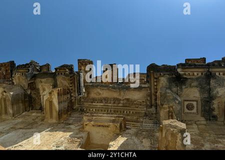 Roman amphitheater in an ancient city castle, detail of old stone walls, columns, stairs, curved historical monumental social building openair theatre Stock Photo