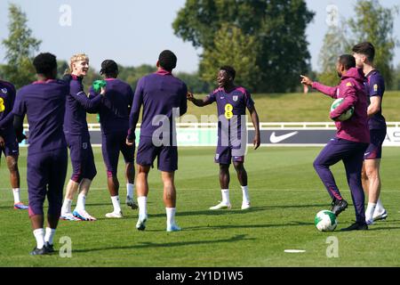 England's Bukayo Saka (right) reacts to Anthony Gordon (second left ...