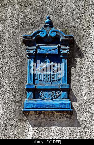 Ancient blue mail box on wall in Tijuca neighborhood, Rio de janeiro, Brazil Stock Photo