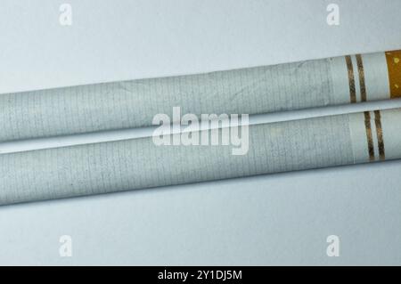 Close up of two cigarettes on white Stock Photo