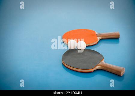 Table tennis balls and paddles sit on a table in southern Arizona. Stock Photo