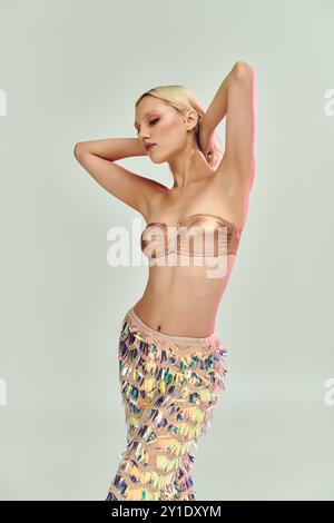 A fashionable woman showcases her unique style with holographic elements. Stock Photo