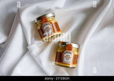 Kirkwall, Orkney, Scotland - July 15, 2024: Food service single serving jars of Heinz Dijon Mustard. Stock Photo