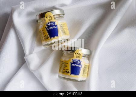 Kirkwall, Orkney, Scotland - July 15, 2024: Food service single serving jars of Heinz mayonnaise. Stock Photo