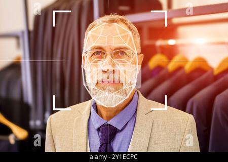 A man is wearing a suit and tie and is being photographed Stock Photo