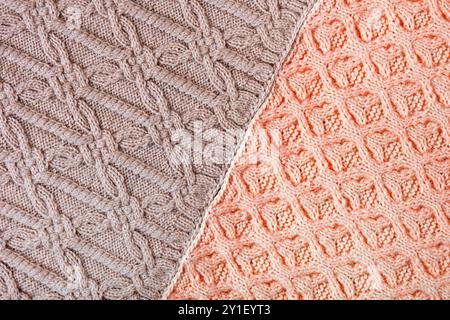 Knitted brown and red background. Large knitted fabric with a pattern. Close-up of a knitted blanket Stock Photo