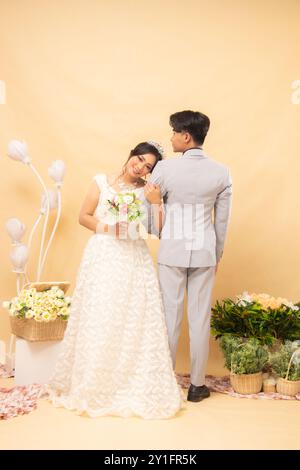 expressions of male and female couples standing poses casually laughing looking at the front of the woman and the man with their backs to each other i Stock Photo