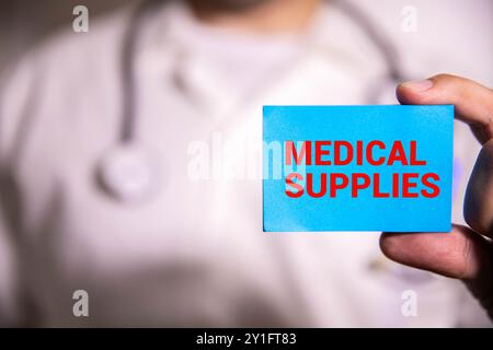 Text Medical Supplies on the white card with the stethoscope and medical documents. Medical concept photo Stock Photo