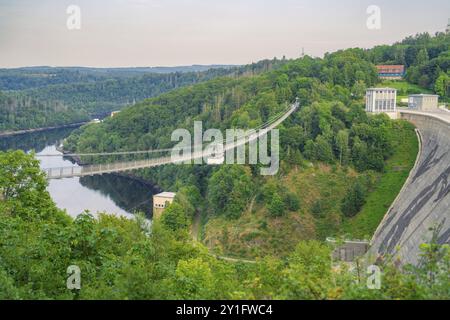 Dam with suspension bridge, surrounded by forest and water, Rappbode Dam, Harz Mountains, Germany, Europe Stock Photo
