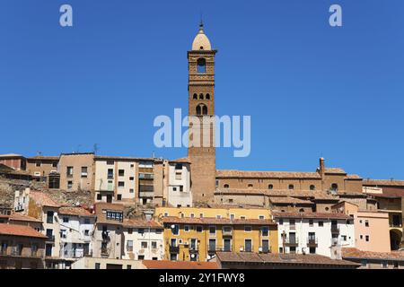 Tall stone building with a narrow tower against a clear blue sky in a historic urban area, Church, Iglesia de Santa Maria Magdalena, Tarazona, Zarago Stock Photo