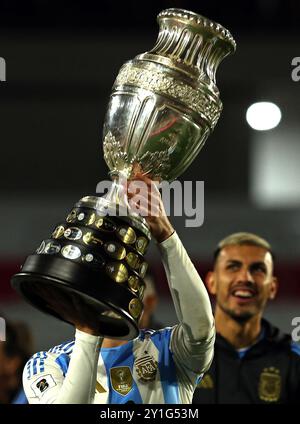 Argentina’s forward Julian Alvarez celebrates with the Copa America trophy as champions of the tournament played in the USA in the months of June-July after the South American qualification football match between Argentina and Chile for the FIFA World Cup 2026 at the Monumental stadium in Buenos Aires on September 5, 2024. Credit: Alejandro Pagni/Alamy Live News Stock Photo