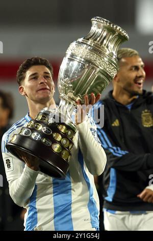 Argentina’s forward Julian Alvarez celebrates with the Copa America trophy as champions of the tournament played in the USA in the months of June-July after the South American qualification football match between Argentina and Chile for the FIFA World Cup 2026 at the Monumental stadium in Buenos Aires on September 5, 2024. Credit: Alejandro Pagni/Alamy Live News Stock Photo