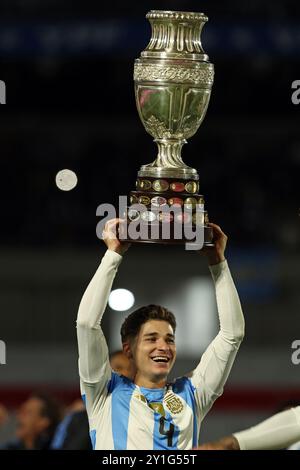 Argentina’s forward Julian Alvarez celebrates with the Copa America trophy as champions of the tournament played in the USA in the months of June-July after the South American qualification football match between Argentina and Chile for the FIFA World Cup 2026 at the Monumental stadium in Buenos Aires on September 5, 2024. Credit: Alejandro Pagni/Alamy Live News Stock Photo