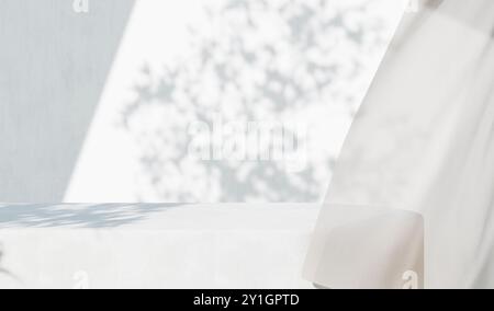 White concrete empty table, organic curtain and plant shadow on cement wall. Summer exterior scene for product placement mockup. Neutral minimal aesth Stock Photo
