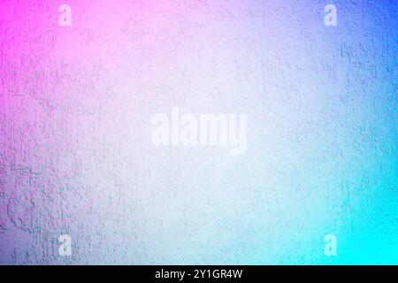 White textured concrete wall with laser neon lights. Abstract iridescent grunge background with holographic colors. Stock Photo
