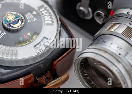 Close up of a vintage photography light meter and a vintage camera. Stock Photo
