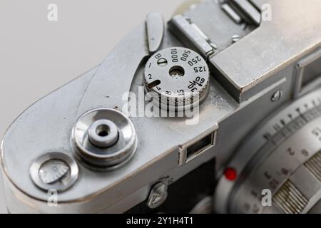 Close up of a classic vintage photo camera showing the various controls on top. Stock Photo