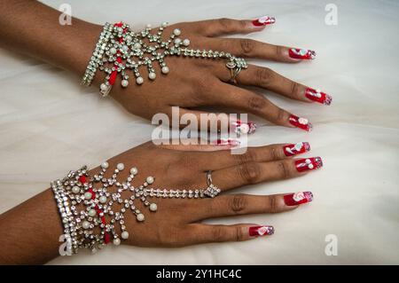 Hand jewelry being worn by a Cambodian bride during a traditional Khmer wedding. Phnom Penh, Cambodia. © Kraig Lieb Stock Photo