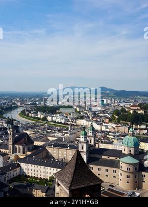 Salzburg, Austria - 31 Aug, 2024: This image showcases a panoramic view of a cityscape with rivers running through it, prominent churches, and various Stock Photo