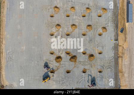 Aerial view of construction site backhoe digging holes, Pennsylvania USA Stock Photo