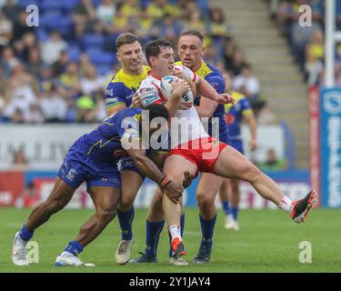 Warrington, UK. 07th Sep, 2024. Matt Whitley of St. Helens is tackled by Rodrick Tai of Warrington Wolves and George Williams of Warrington Wolves during the Betfred Super League Round 25 match Warrington Wolves vs St Helens at Halliwell Jones Stadium, Warrington, United Kingdom, 7th September 2024 (Photo by Alfie Cosgrove/News Images) in Warrington, United Kingdom on 9/7/2024. (Photo by Alfie Cosgrove/News Images/Sipa USA) Credit: Sipa USA/Alamy Live News Stock Photo