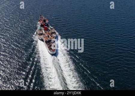 The Waverley paddle steamboat full with tourists travelling from Glasgow to Rothesay Stock Photo