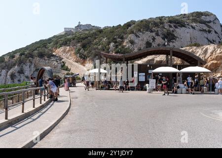 Alghero, Italy - August 25, 2023: Neptune's Grotto (Grotta di Nettuno) ticket offices near Alghero in Sardinia island, with tourist people in the a po Stock Photo